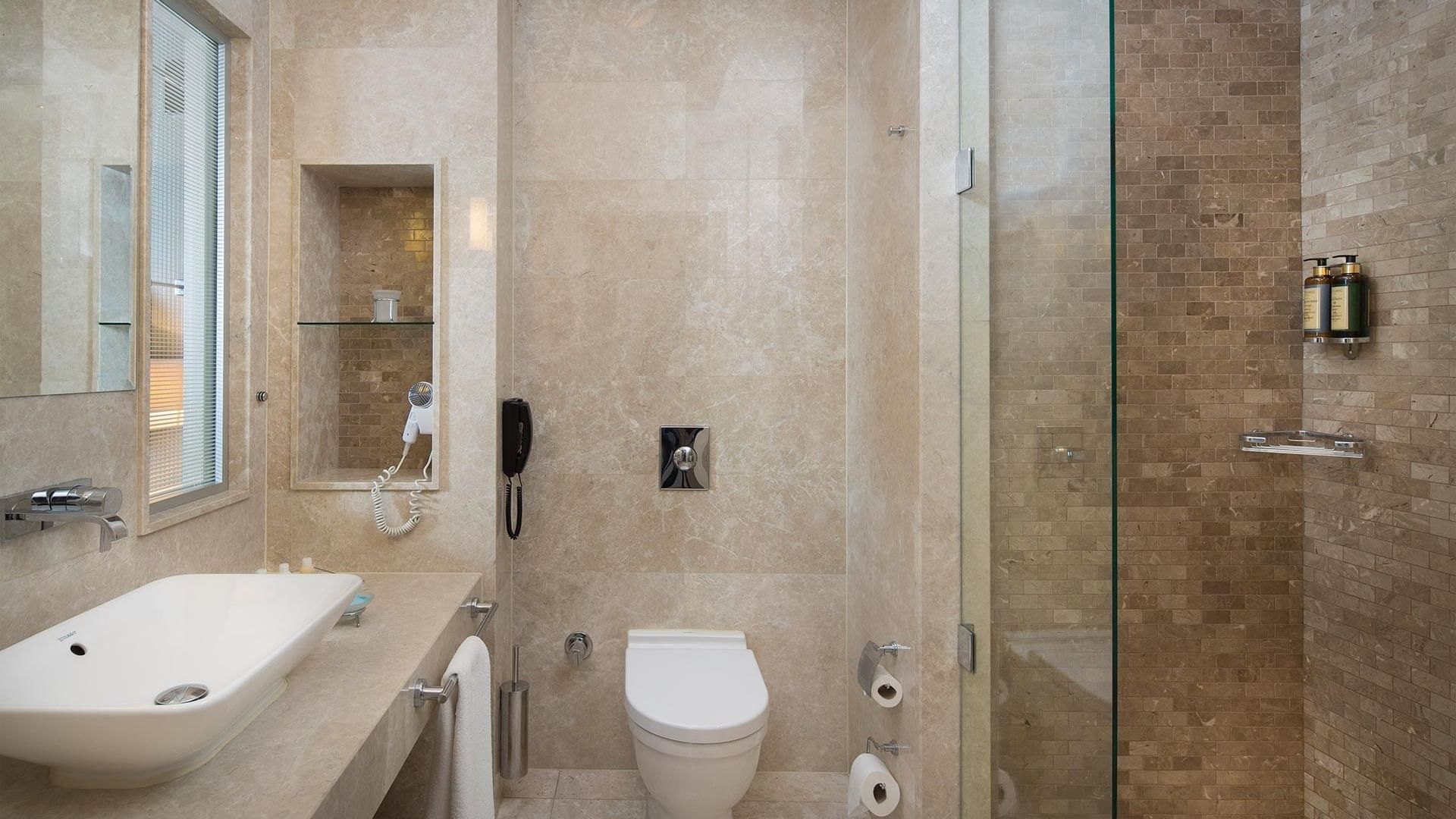 Bathroom vanity with shower room, commod, and wash basin in Superior Room at Titanic Business Kartal