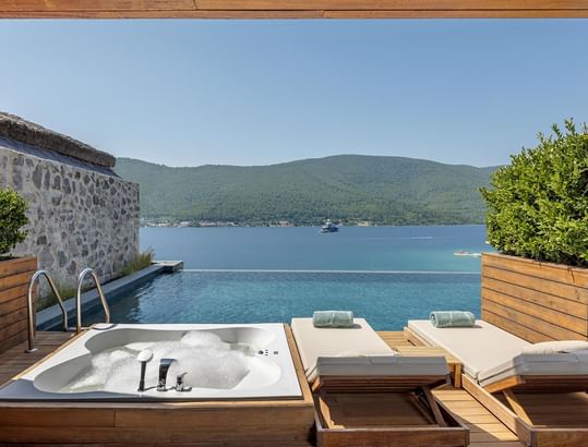Private terrace of the Exclusive Swim-up Room overlooking the pool at Titanic Luxury Collection Bodrum