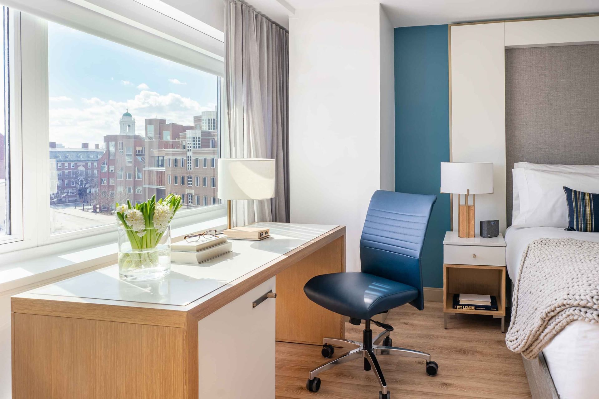 desk in hotel room overlooking harvard square
