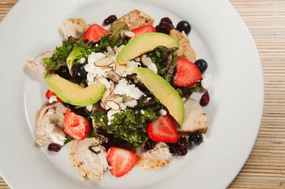 Chicken salad with avacado slices and fruit