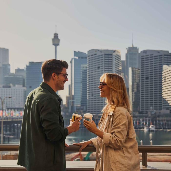 Couple enjoying sunset drinks on ibis bar deck