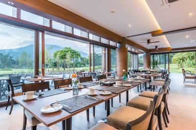 Seating arrangements at Chatrium Golf Resort's Restaurant