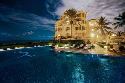 Night view of the pool and the hotel at Somerset On Grace Bay