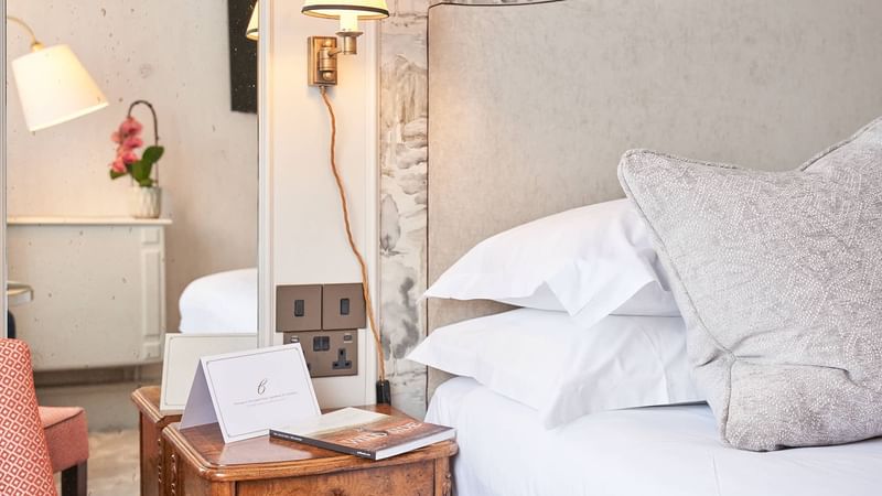 Nightstand & lamp by the king bed in Classic Room at The Capital Hotel London