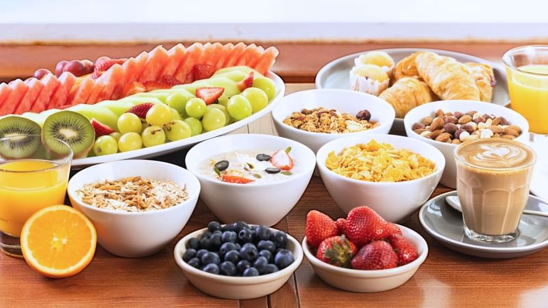 Buffet Breakfast healthy selection with fruits, nuts, cereals, juices and coffee