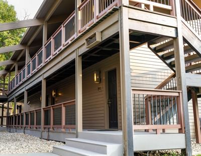Exterior of a guest building at The Ranch at Ucross, showcasing multiple levels and a staircase