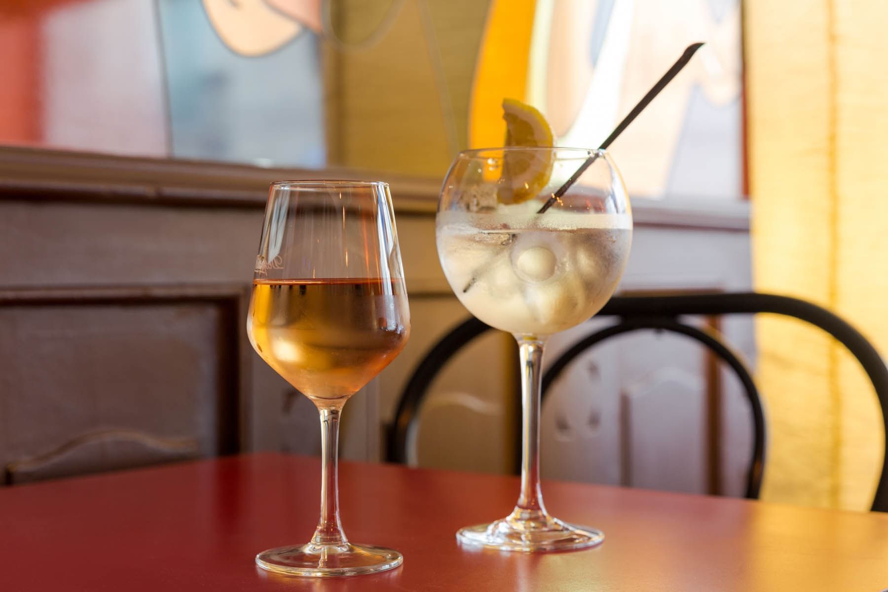 A glass of wine and a cold beverage served at the restaurant