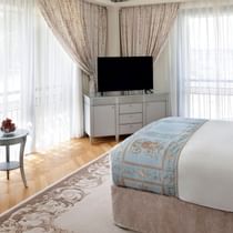 TV & king bed in Bedroom residence at Palazzo Versace Dubai