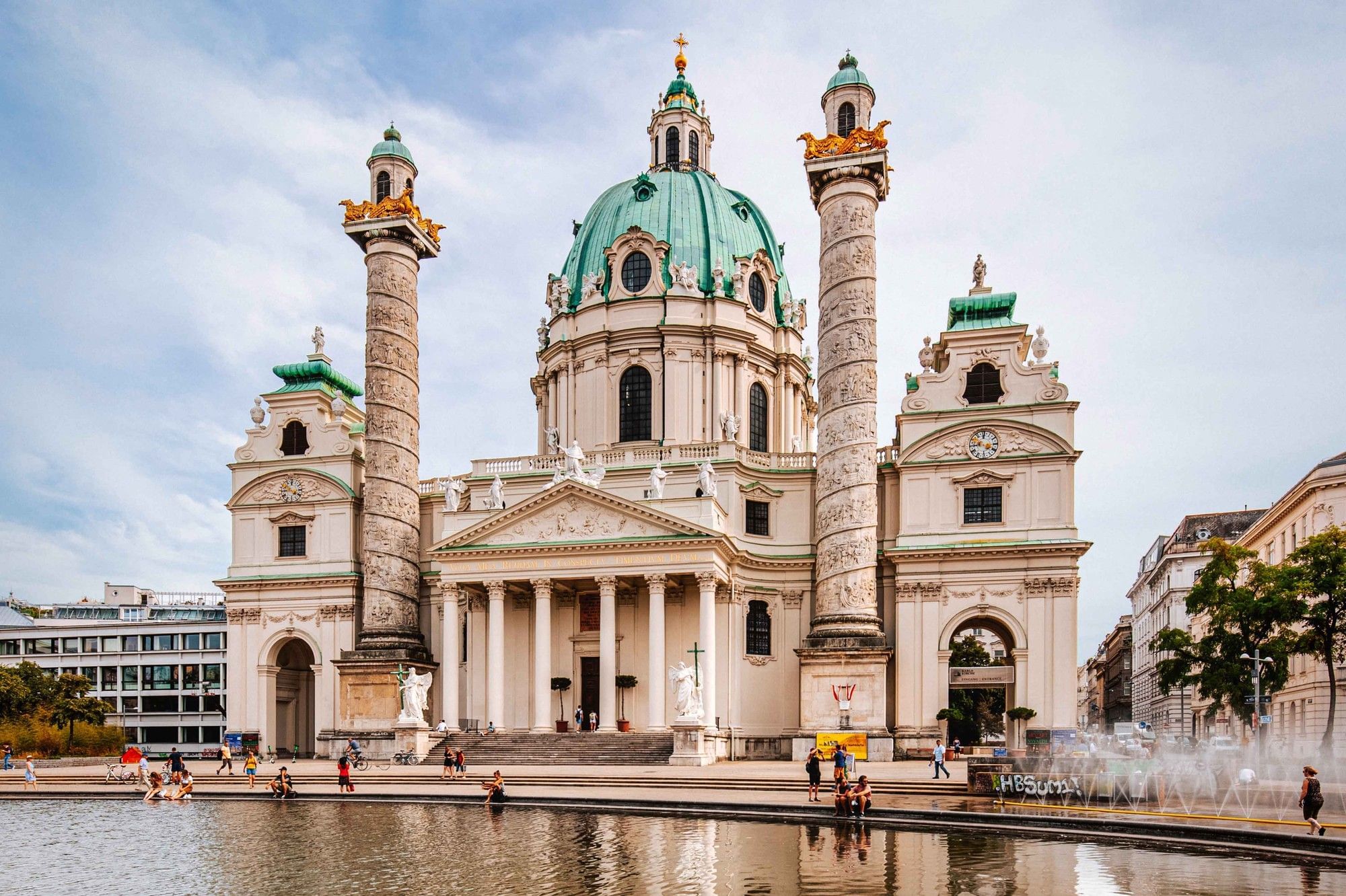 St. Charles’s Church with its striking dome and the two relief covered columns, set in front of the large reflecting pool at Karlsplatz