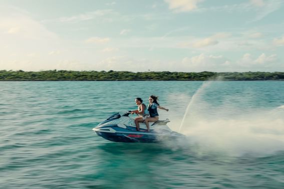 Couple jet skiing near H2O Life Style Resort