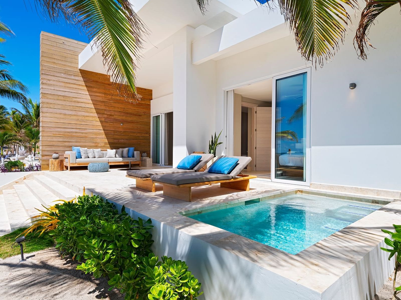 Outdoor plunge pool with loungers in Beachfront 3 Bedroom Villa at Alaia Belize Autograph Collection