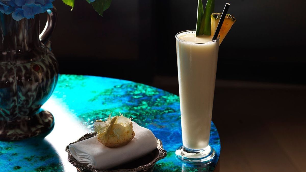 Piña colada garnished with pineapple in Icebergs Harbour Bar at Crown Hotels