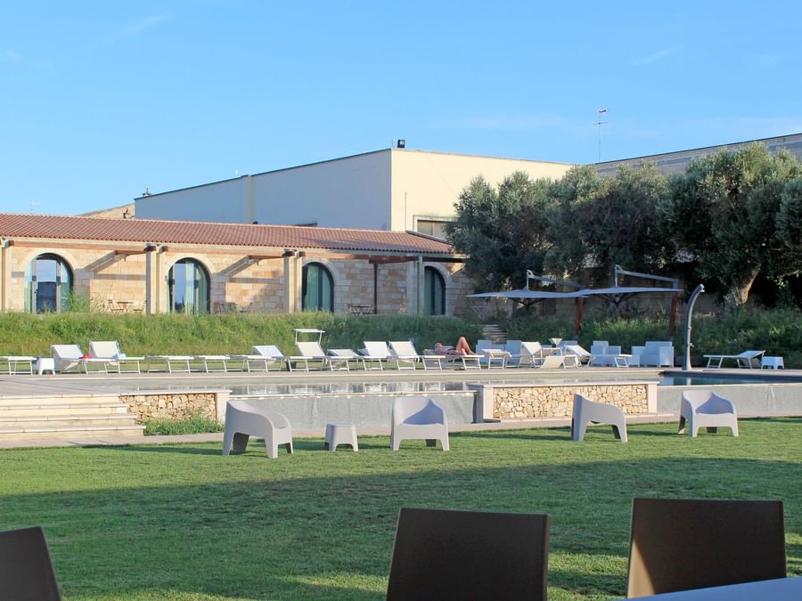 View of the outdoor garden lounge area at Hotel Masseria Stali