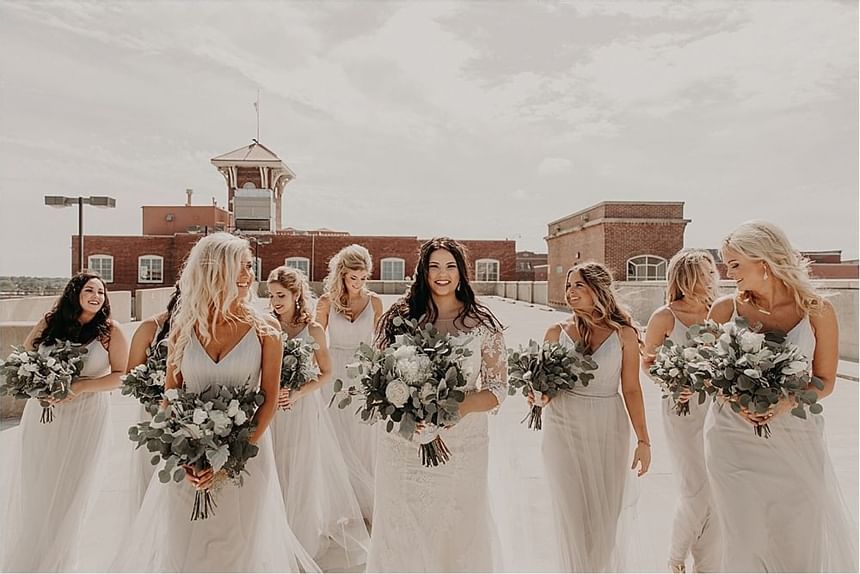 Bride with Bridesmaids near Hotel at Old Town Wichita