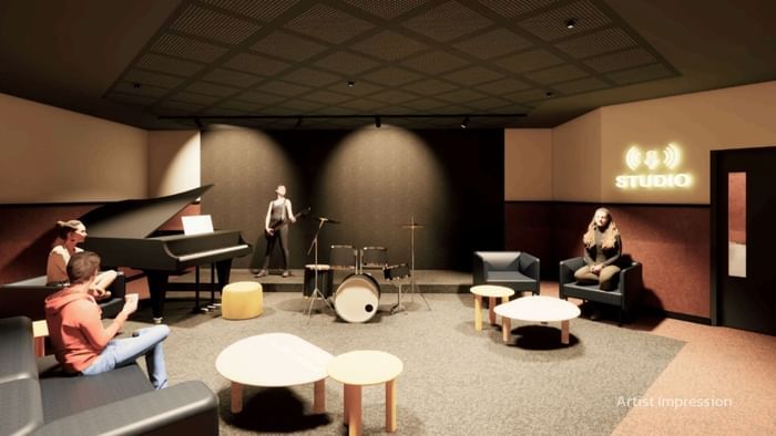 People playing instruments in a music studio at UniLodge Brisbane City.