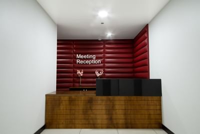 Meeting reception area with desk and flower vase decorations at D Sabana Hotel, 5 star Hotels in San Jose Costa Rica