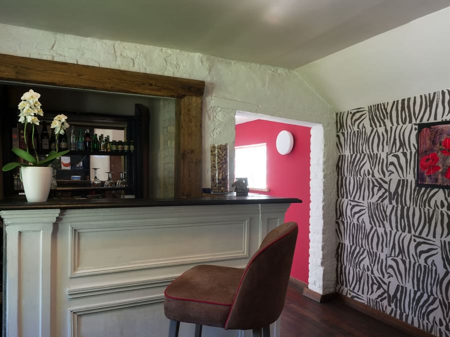 Bar counter & lounge area at La Ferme Blanche
