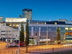 The exterior of Indoor Stadium near Sternen Oerlikon at night