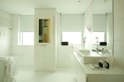 Bathroom with bathtub & vanity in Premium Suite at Hotel Presidente Luanda