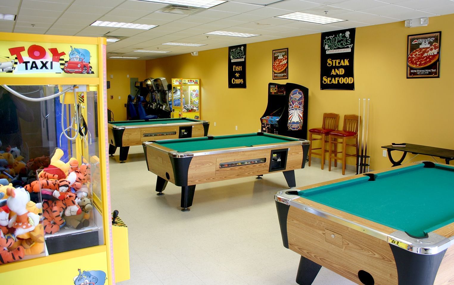 Game room with pool table and arcade games at Lake Buena Vista Resort Village & Spa