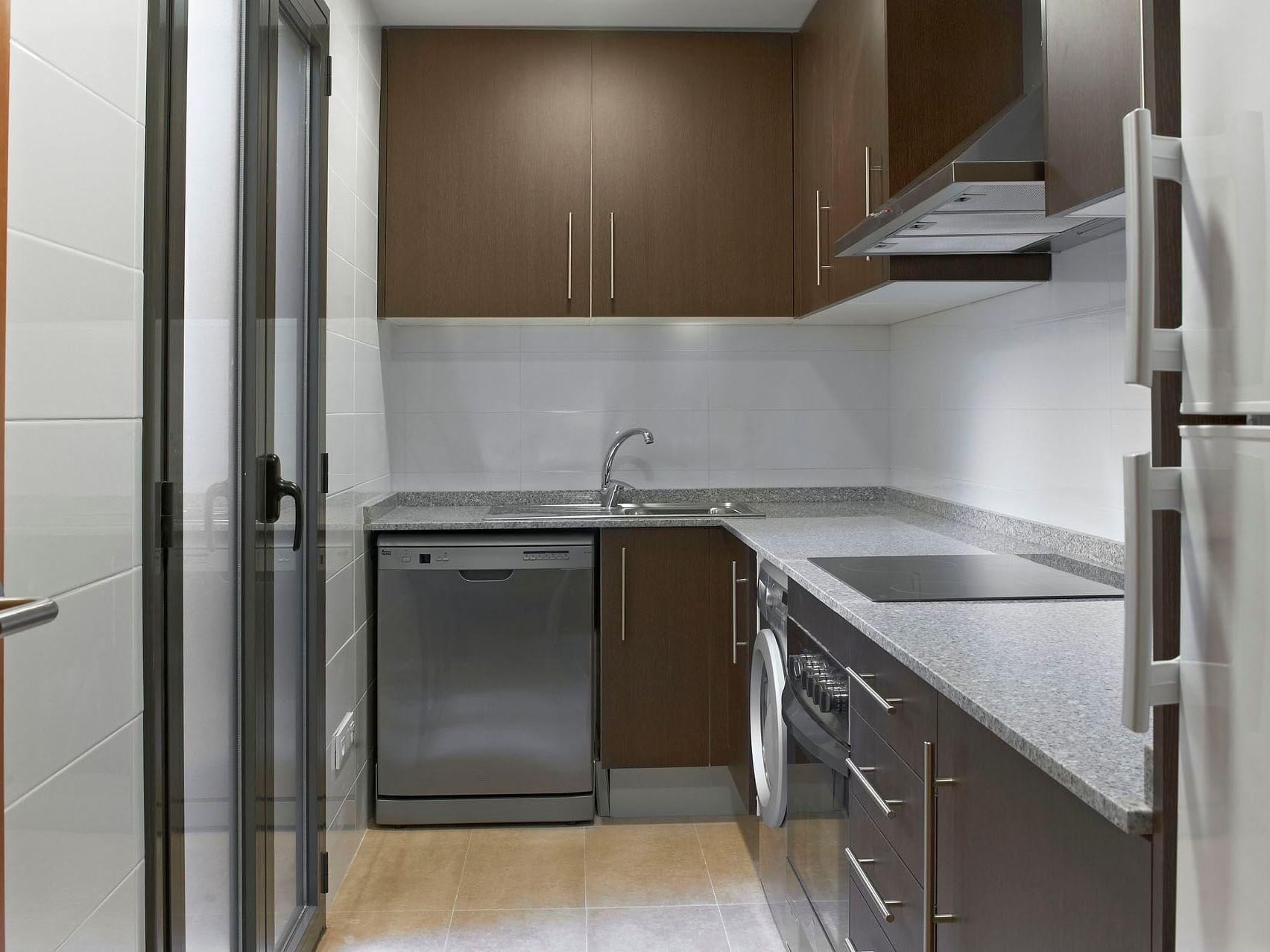 Kitchen area in Deluxe room at Barcelona Apartment