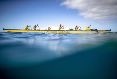 Group on a canoe in the ocean at Ka'anapali Beach Hotel Hawaii