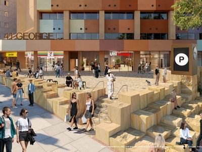 Exterior of UniLodge Brisbane City with people walking and sitting around.