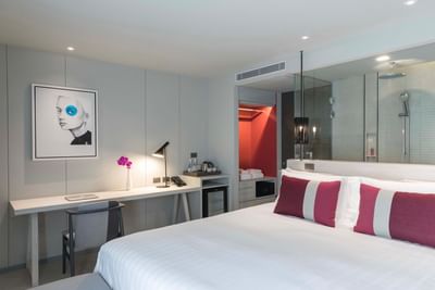 Room with double bed and a work desk at U Hotels & Resorts