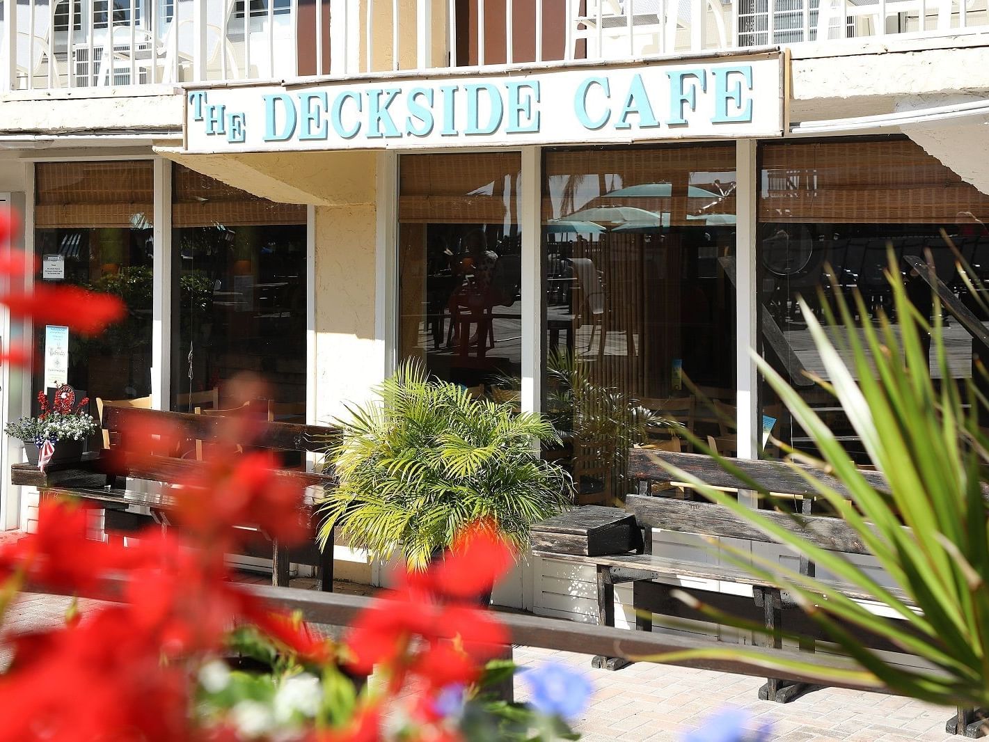 View looking at Deckside Cafe sign on front of building