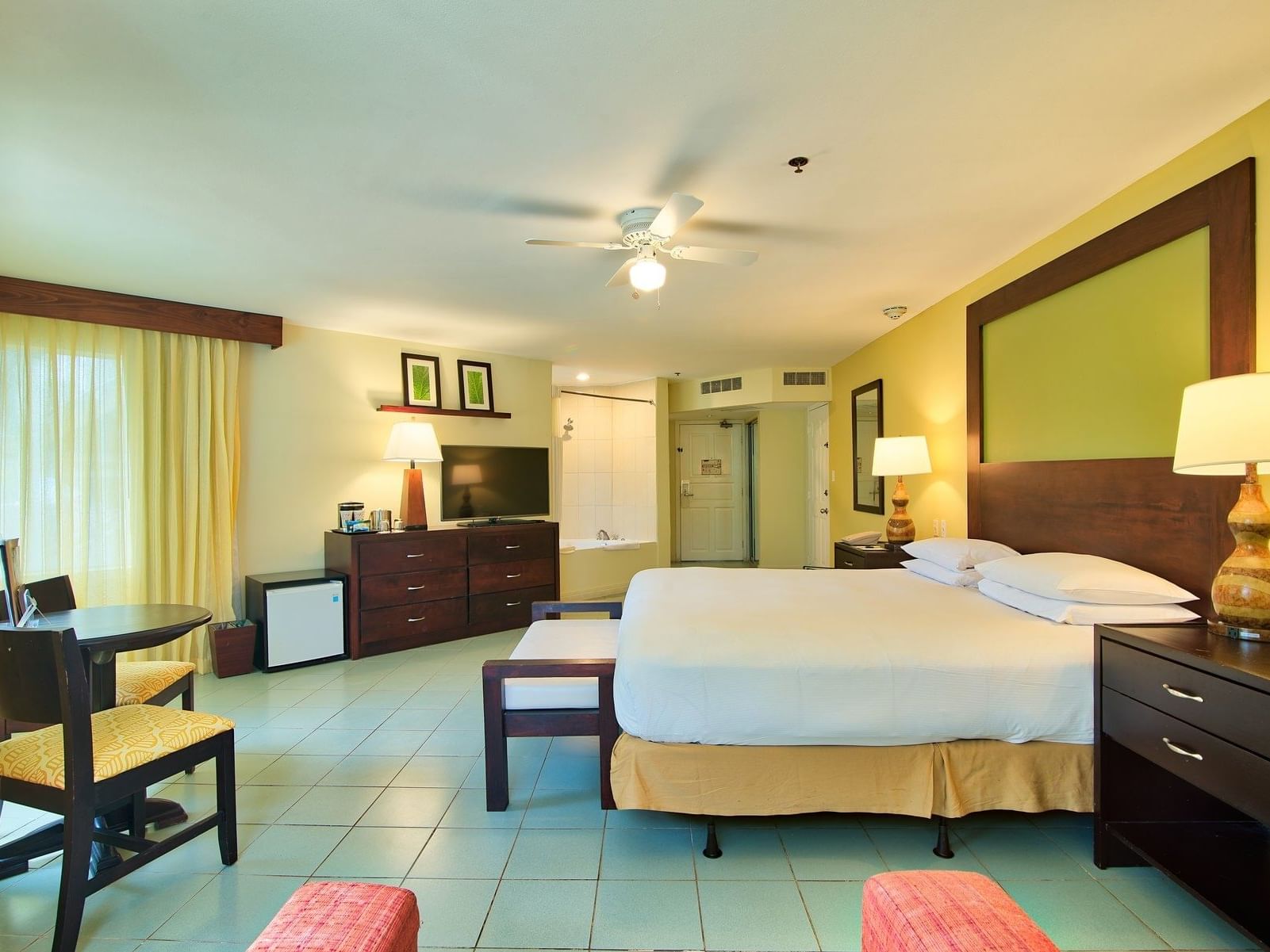 Interior view of Jr Honeymoon Suite with king bed at Fiesta Resort