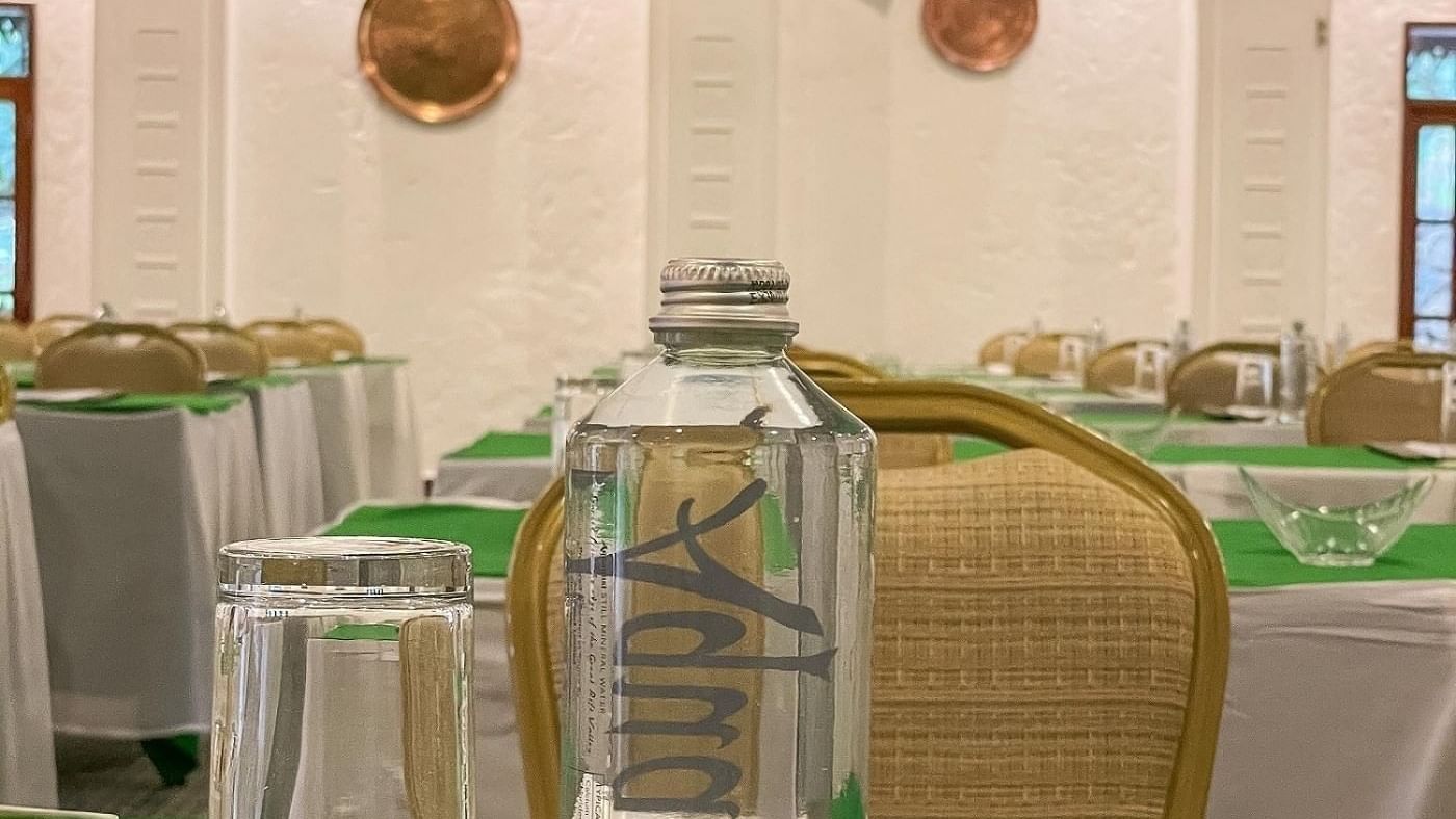 Flame Tree event room at Serena Beach Resort & Spa in Mombasa with water bottle and glass.