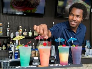 Bartender serving up 5 festive drinks