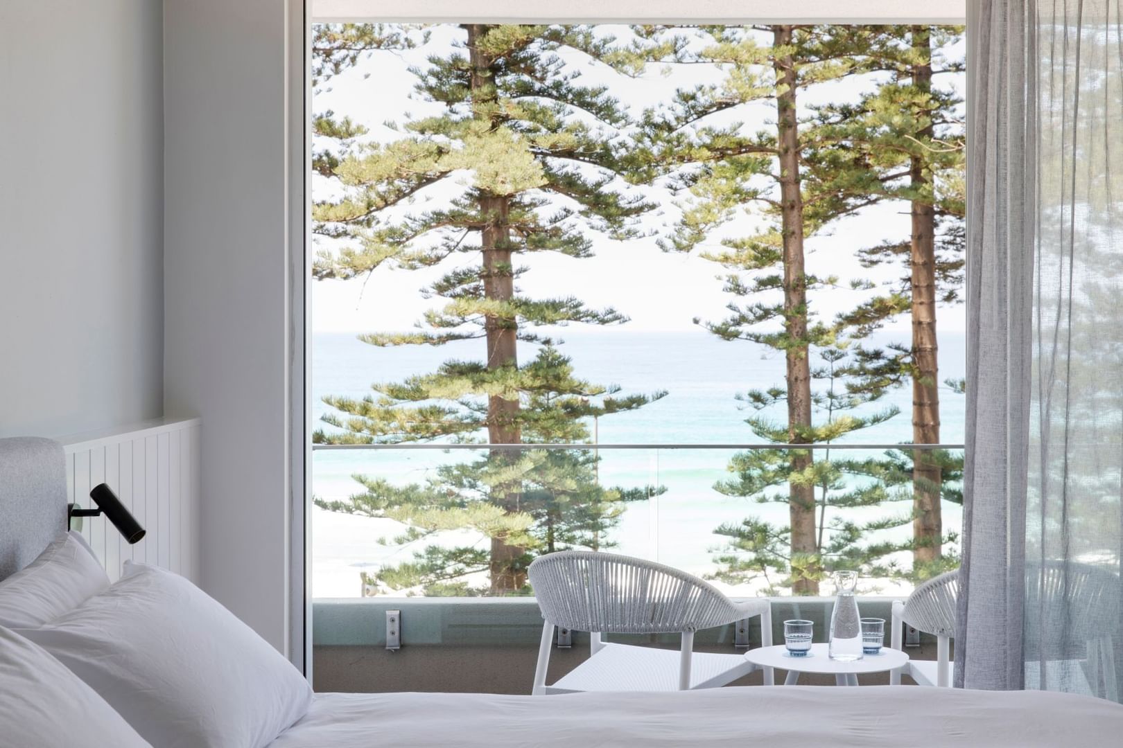Ocean View King at Elysium Manly offering places to stay in Manly with a white bed and an ocean-facing balcony