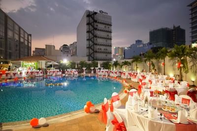 Banquet rounds arranged for a night function by the pool at Eastin Grand Hotel Saigon