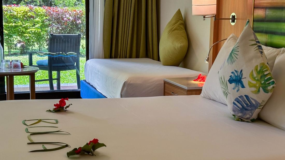 Superior Garden View Room at The Naviti Resort in Korolevu Fiji with bed and garden view.