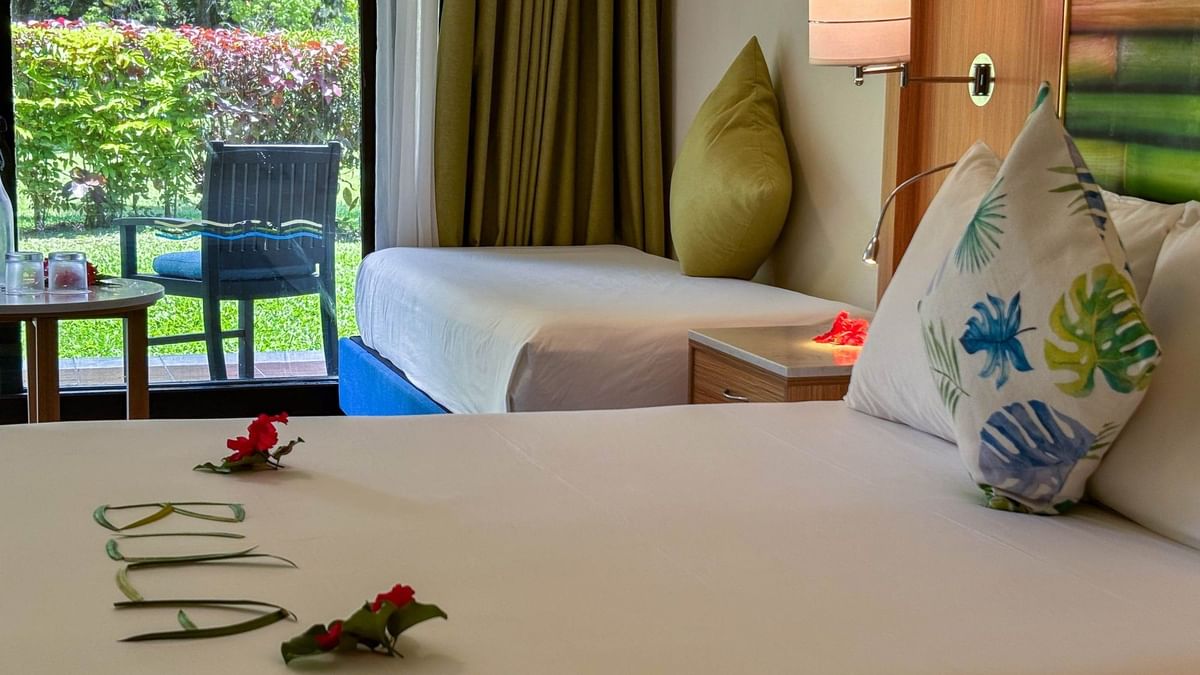Superior Garden View Room at The Naviti Resort in Korolevu Fiji with bed and garden view.