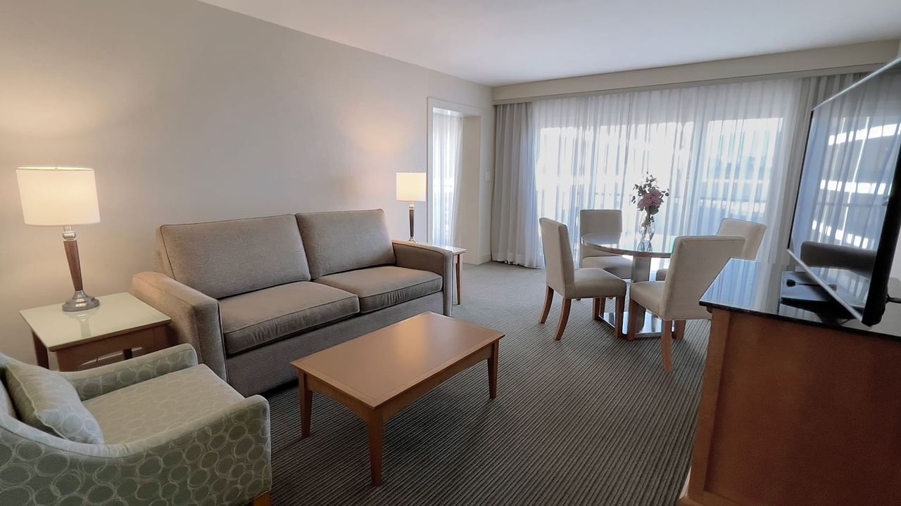 Guest room with couch, table, dining table and chair