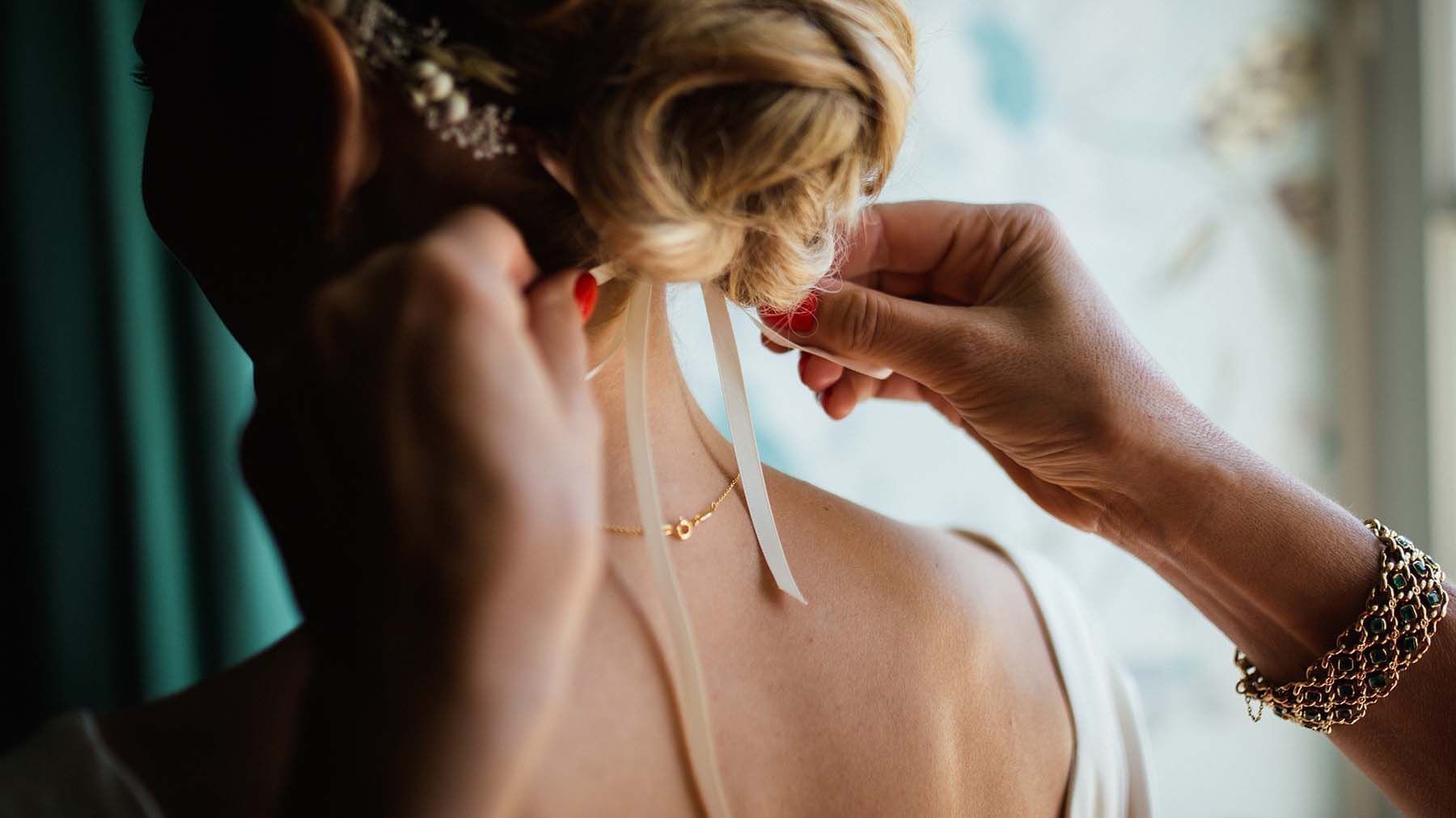 fixing bride's hair