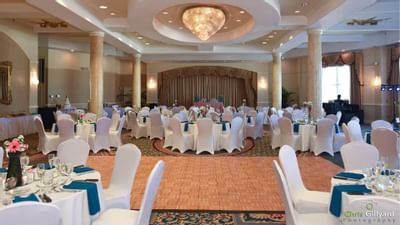 banquet hall with decorated tables and lighting