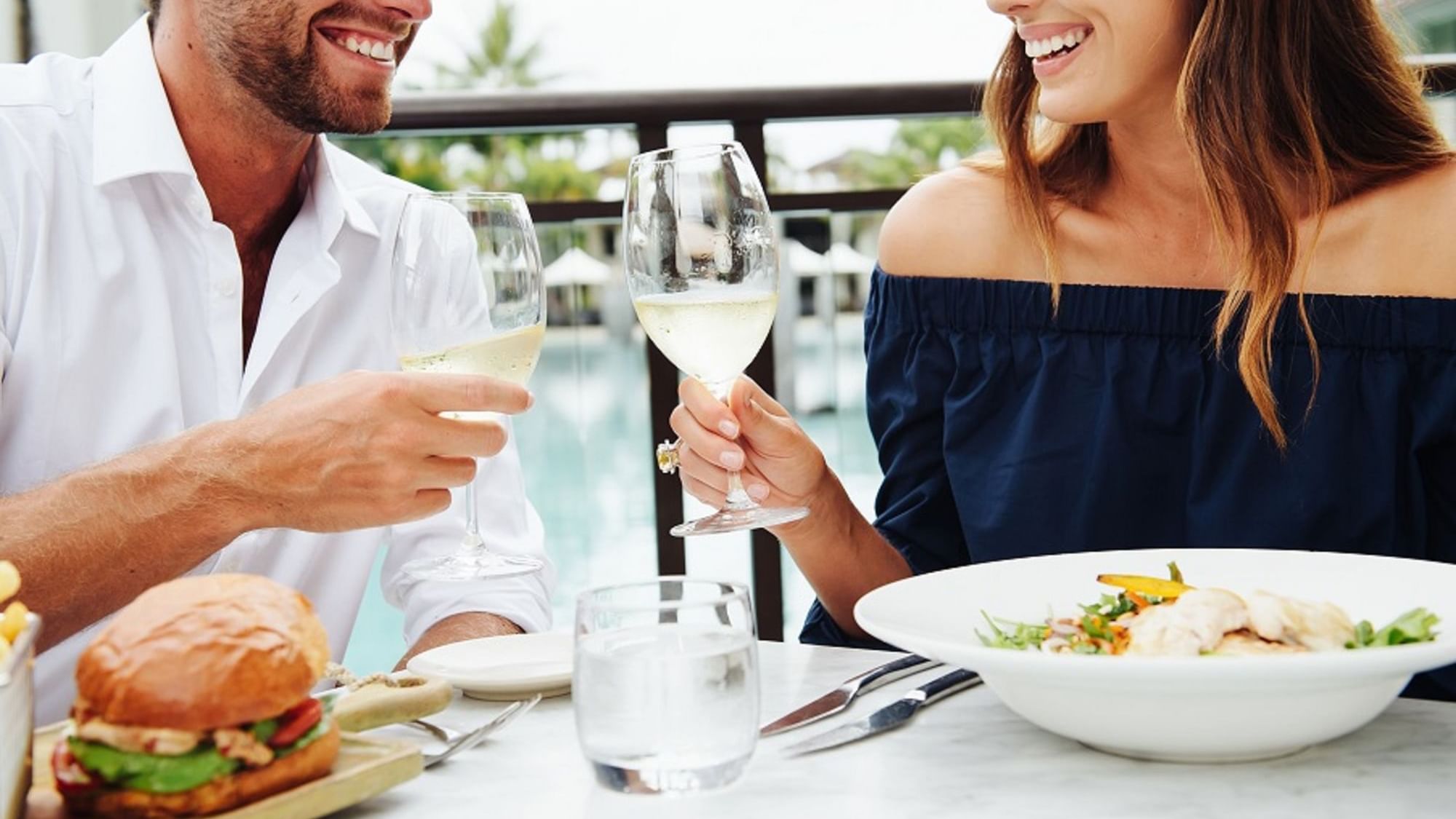 Couple cheering at Pullman Port Douglas sea temple resort and spa