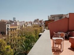 Balcony dining area with a city view at Aparthotel Allada