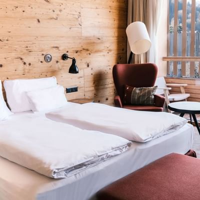 Bed & sitting area, Deluxe Plus Room at Falkensteiner Hotels
