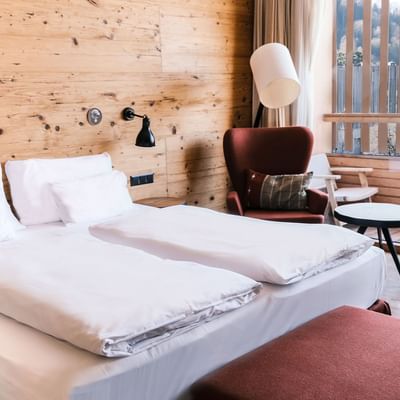 Bed & sitting area, Deluxe Plus Room at Falkensteiner Hotels