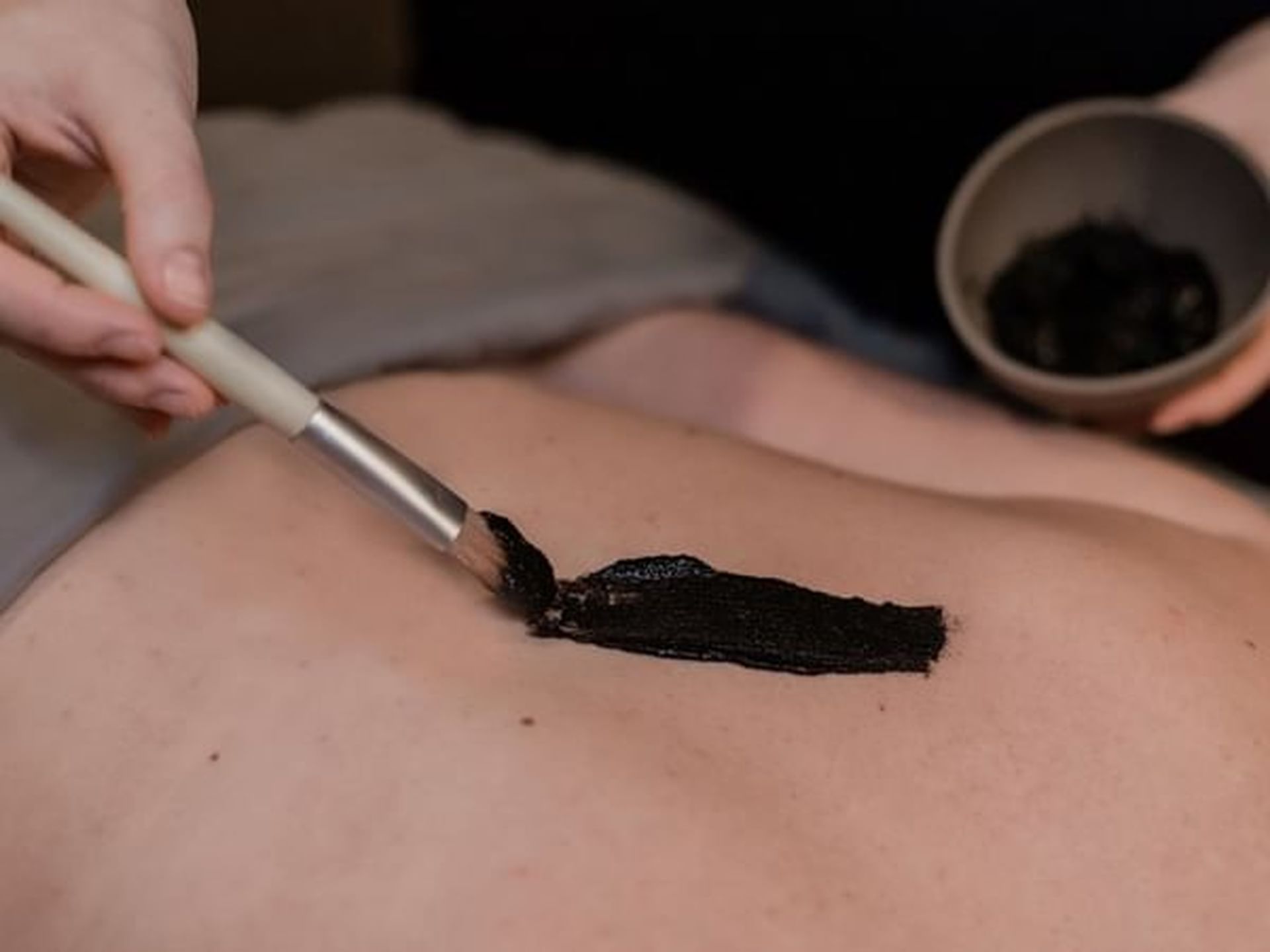 Close-up of a lady having a body treatment in The Spa at Alderbrook Resort & Spa