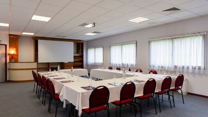 Table arrangement in a meeting room at Le Logis d'Elbee
