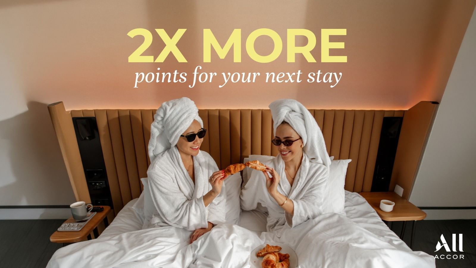 Two guests eating breakfast ib bed