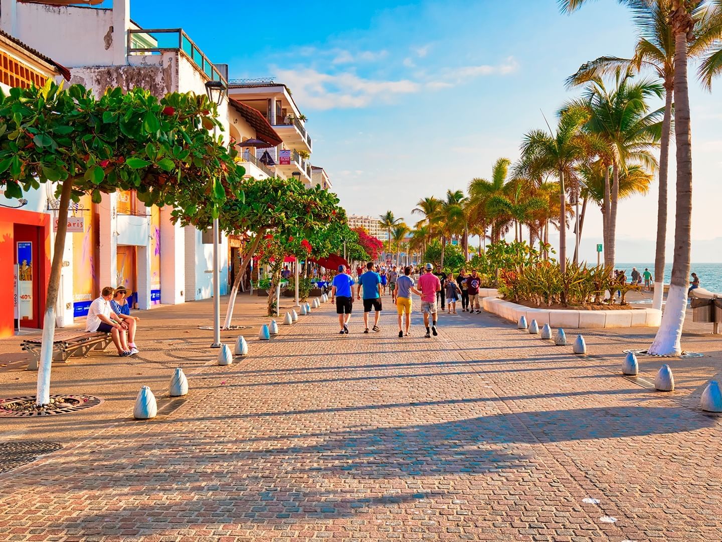 People walking on the Boardwalk El Malecón pavilion near Plaza Pelicanos Club Beach Resort