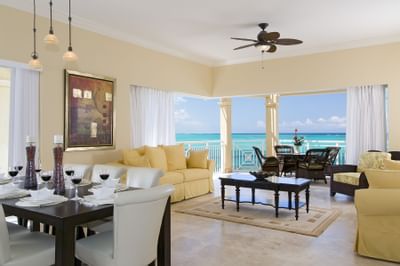 Dining area and living room in Penthouse Suite at Windsong Resort On The Reef
