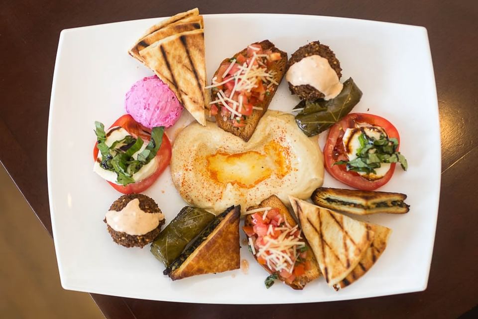 Plate of hummus, falafel, pita, and vegetables at Pickwick San Francisco