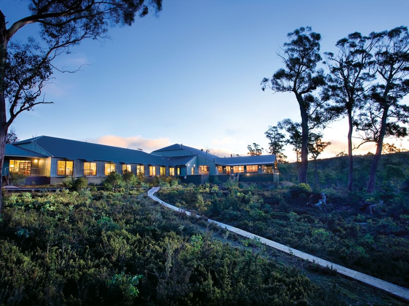 Exterior view of Cradle Mountain Hotel & evening sky
